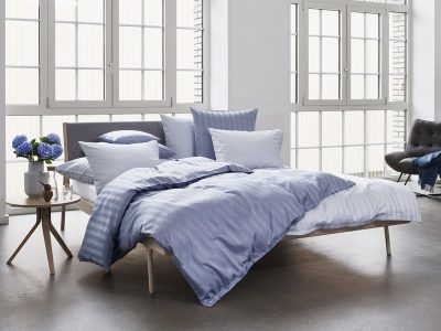 Exklusiva sängkläder som skapar ett exklusivt sovrum. Ett exklusivt bäddset ger en mycket lyxig känsla.